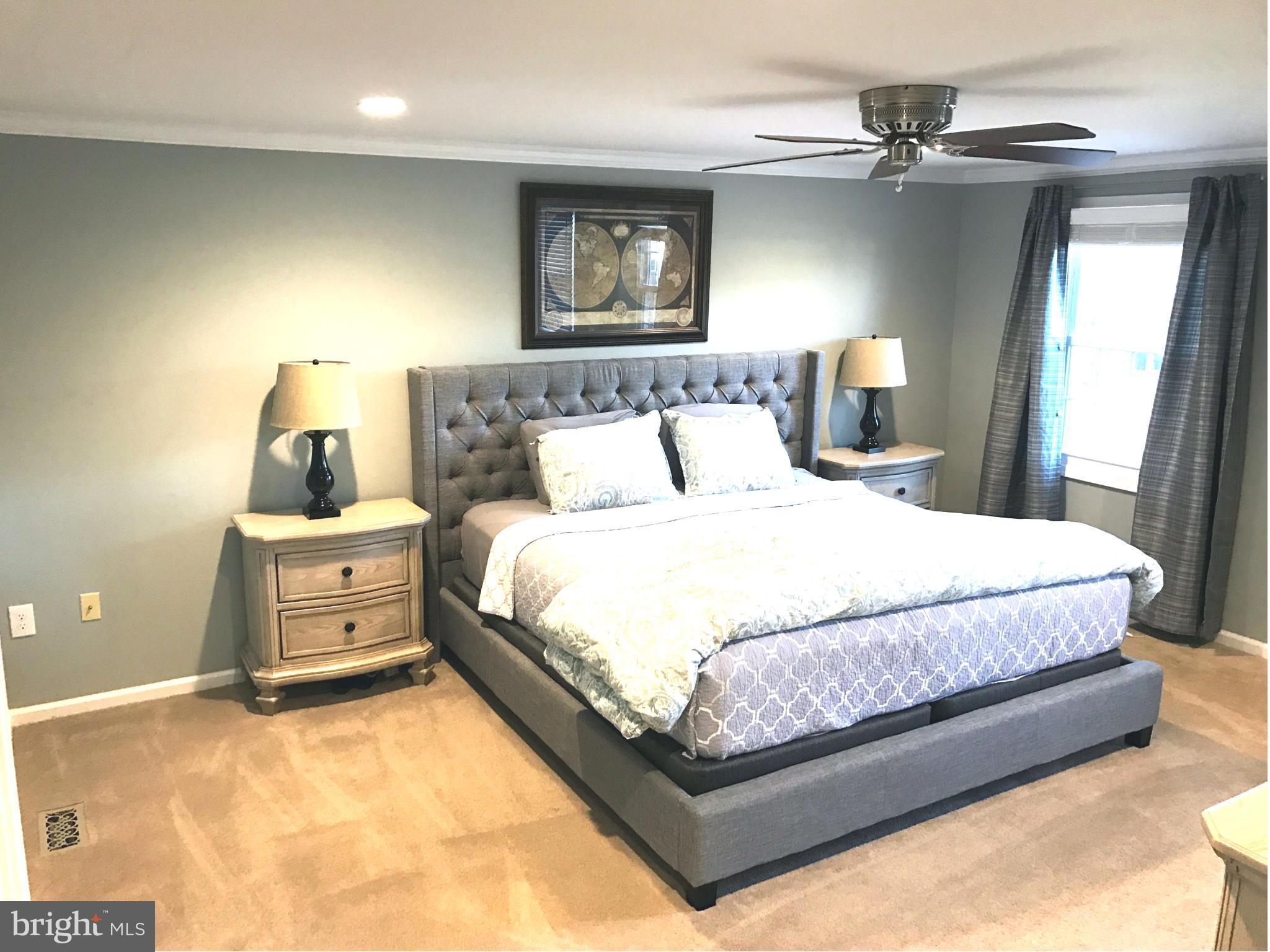 3112 Newcastle Lane Riva, MD 21140 - Photo 9 of 27 a bedroom with a bed and wooden floor