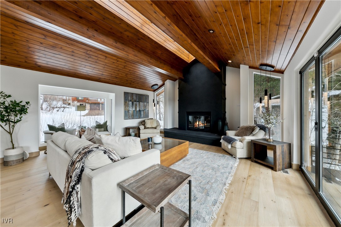 987 Wander Way Incline Village, NV 89451 - Photo 11 of 45 a living room with furniture a large window and wooden floor