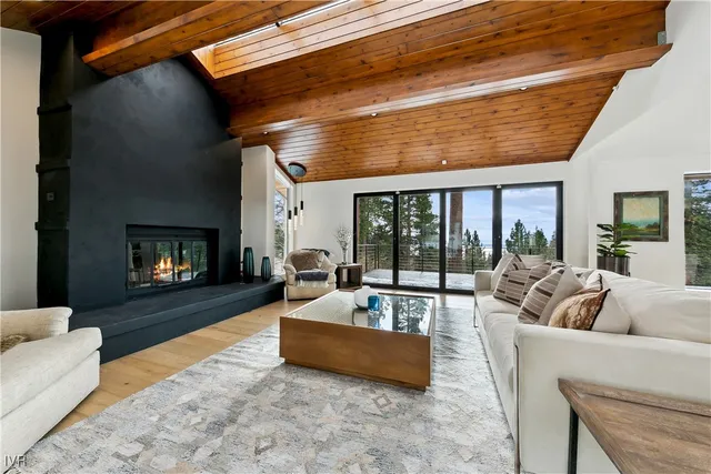 a kitchen with a sink and large window