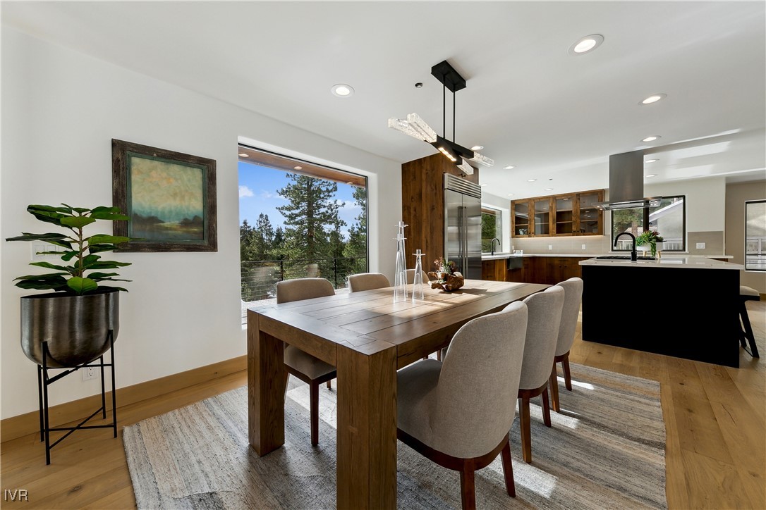 987 Wander Way Incline Village, NV 89451 - Photo 16 of 45 a view of a dining room with furniture window and wooden floor
