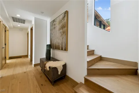a bedroom with furniture and a large window