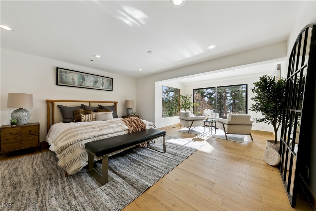 987 Wander Way Incline Village, NV 89451 - Photo 24 of 45 a bedroom with furniture and a large window