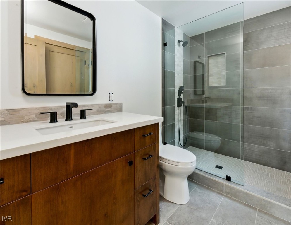 987 Wander Way Incline Village, NV 89451 - Photo 29 of 45 a bathroom with a toilet sink and mirror