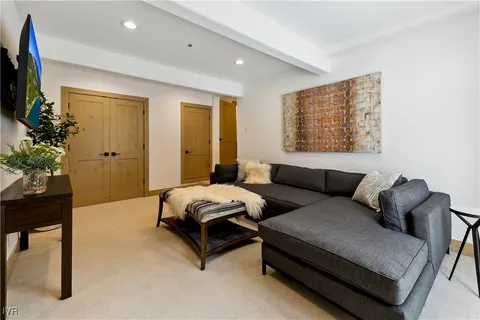 an empty room with windows and entrance