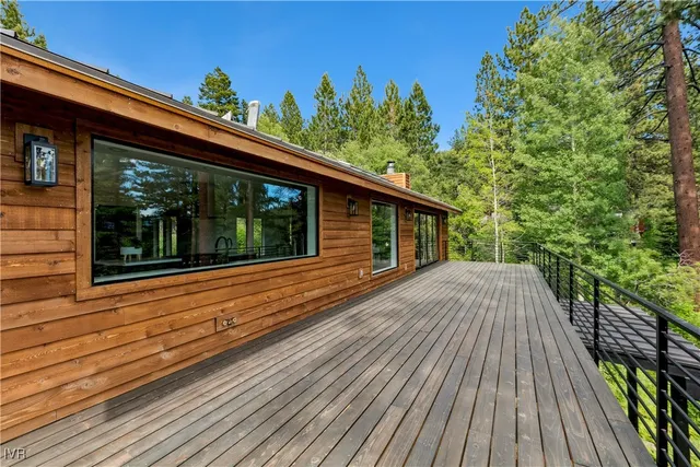 a view of a yard with wooden fence
