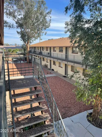 a view of a backyard with a patio