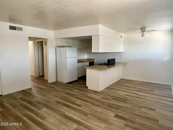 a kitchen with stainless steel appliances a sink and a refrigerator