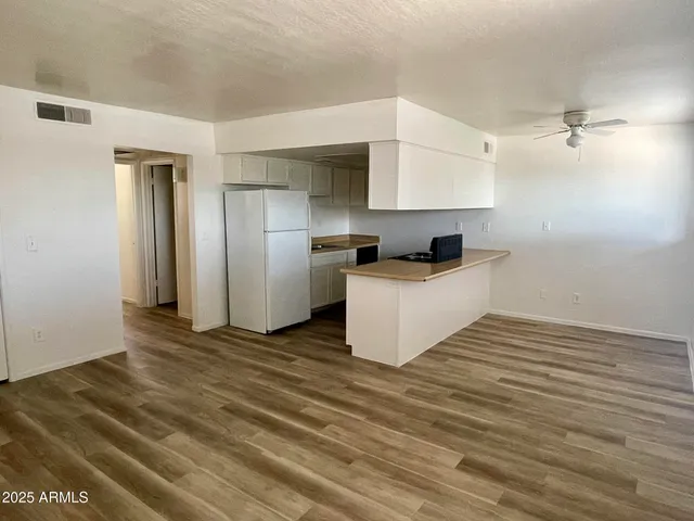 a kitchen with stainless steel appliances a sink and a refrigerator