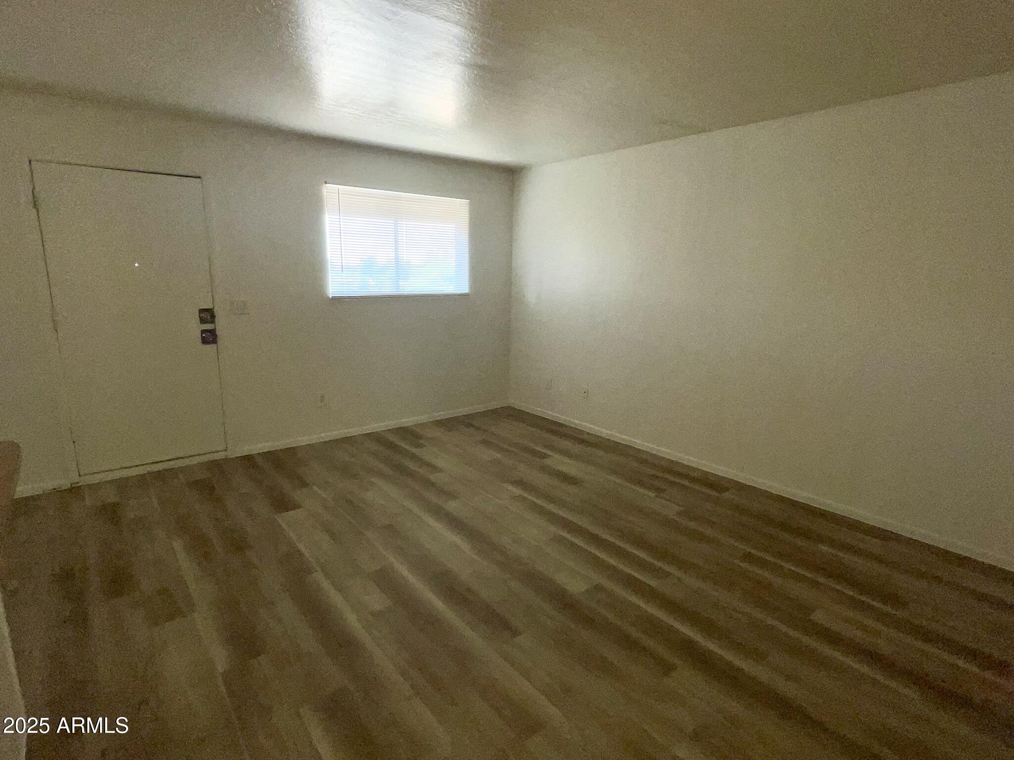 2002 East Sweetwater Avenue, Unit 202 Phoenix, AZ 85022 - Photo 9 of 22 an empty room with a window