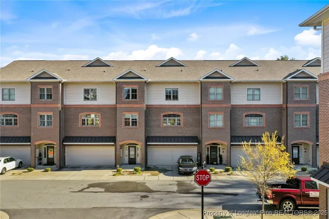 a view of an entryway with wooden floor and stairs