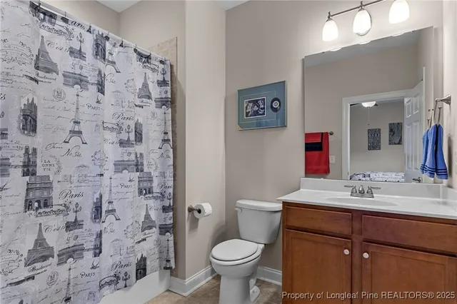 a bathroom with a tub double sink window and mirror