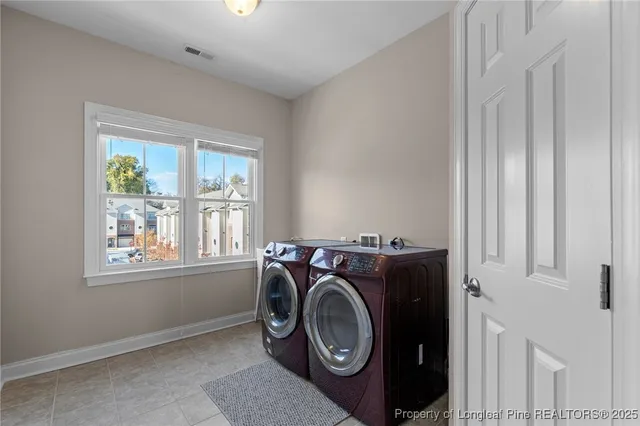 a bathroom with a tub sink and window
