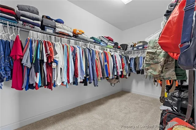 a view of a patio with a table and chairs