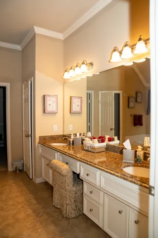 a bathroom with a double vanity sink and a mirror