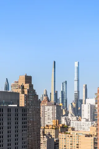 a view of a city with tall buildings