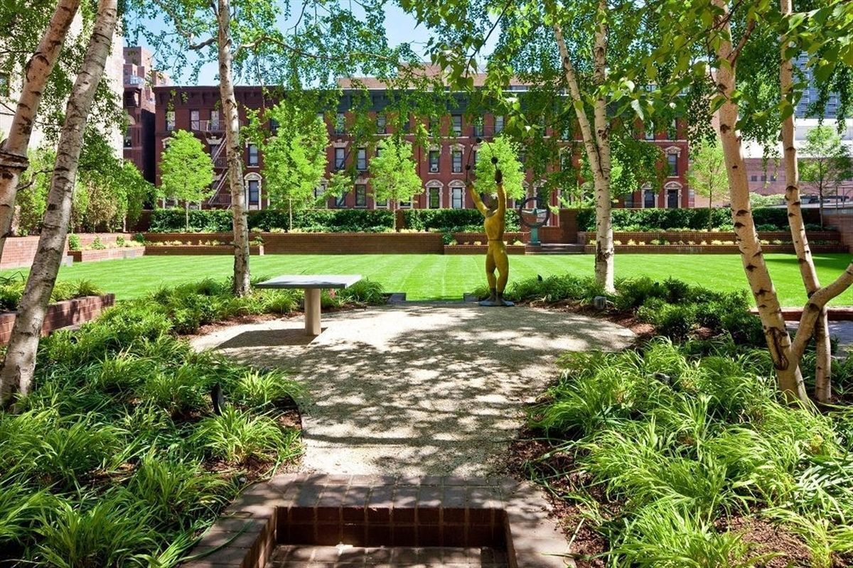 515 East 72nd Street, Unit 32C Manhattan, NY 10021 - Photo 14 of 15 a view of a park with large trees