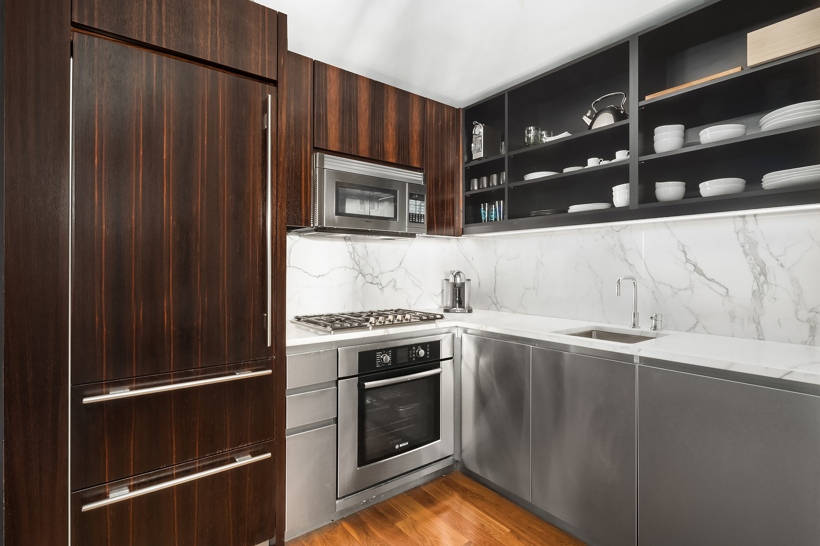 515 East 72nd Street, Unit 32C Manhattan, NY 10021 - Photo 4 of 15 a kitchen with granite countertop a stove and a refrigerator