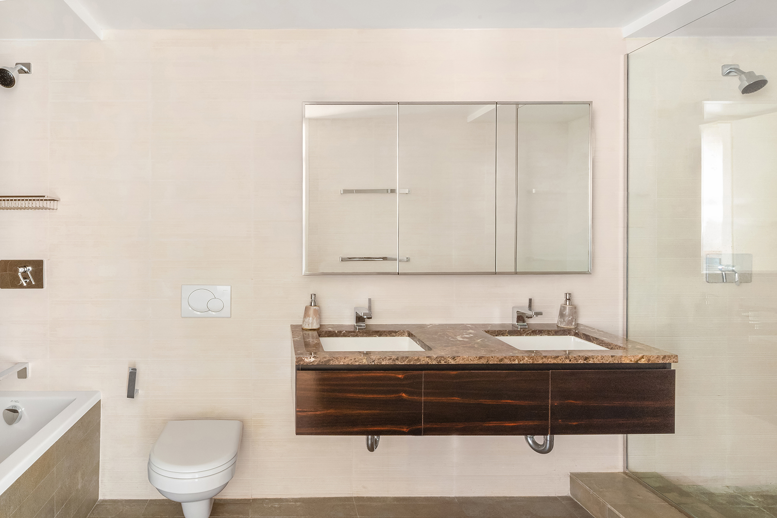 515 East 72nd Street, Unit 32C Manhattan, NY 10021 - Photo 7 of 15 a bathroom with a granite countertop sink a toilet and a mirror
