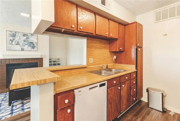 a utility room with a sink a washer and dryer