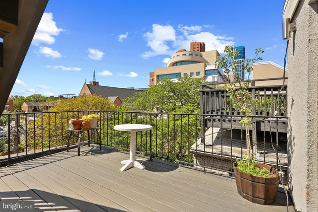 a view of a balcony with chairs