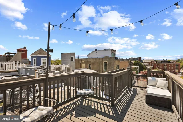 a view of a balcony with furniture