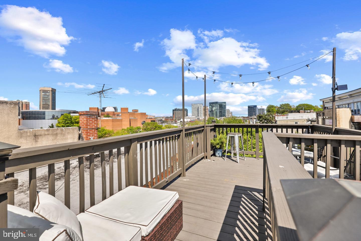730 Light Street, Unit C Baltimore, MD 21230 - Photo 17 of 19 a view of a balcony with wooden chairs