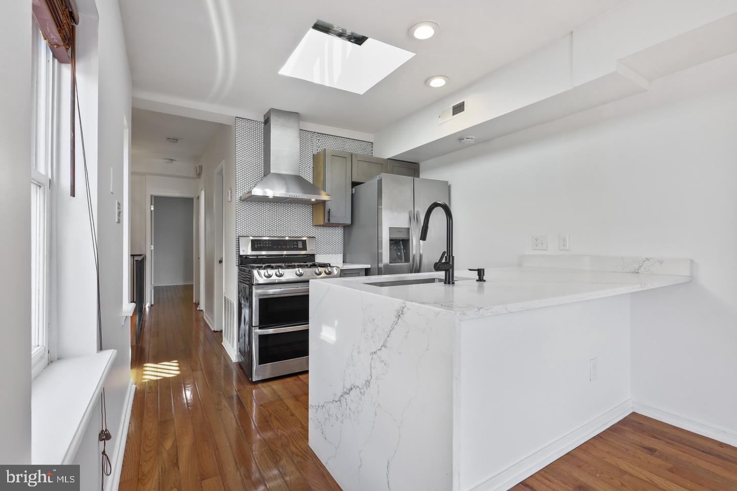 730 Light Street, Unit C Baltimore, MD 21230 - Photo 2 of 19 a kitchen with stainless steel appliances granite countertop a stove and a refrigerator