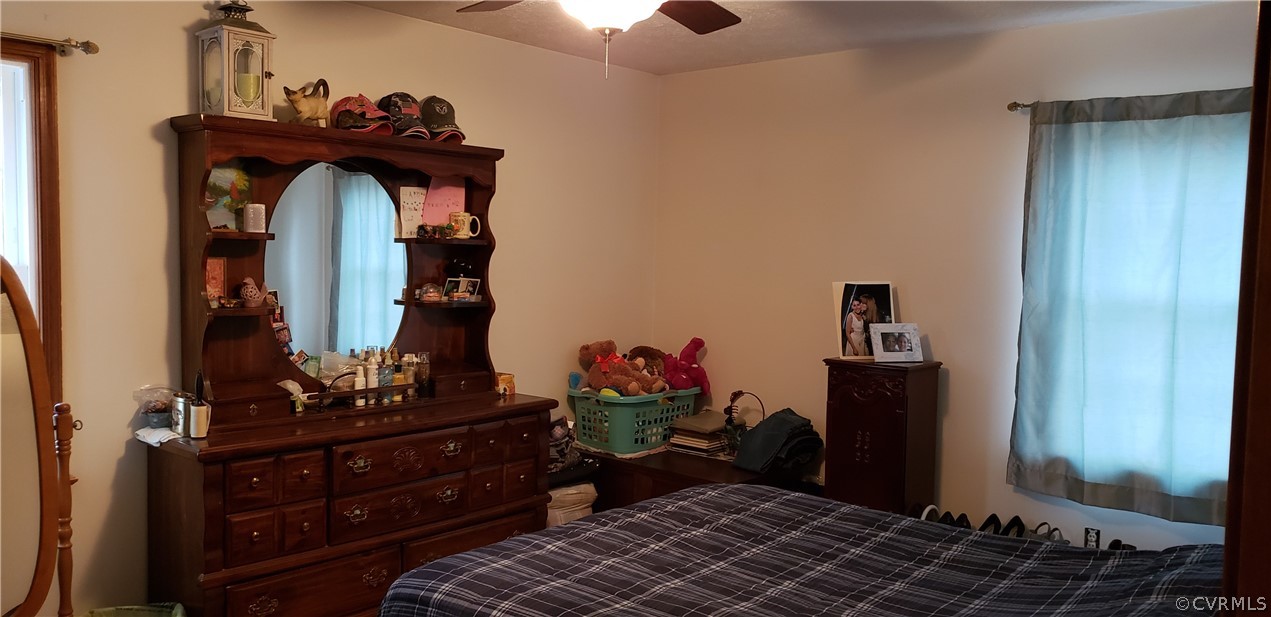 3963 Cedar Plains Road Sandy Hook, VA 23153 - Photo 6 of 12 a room with a dresser and a mirror
