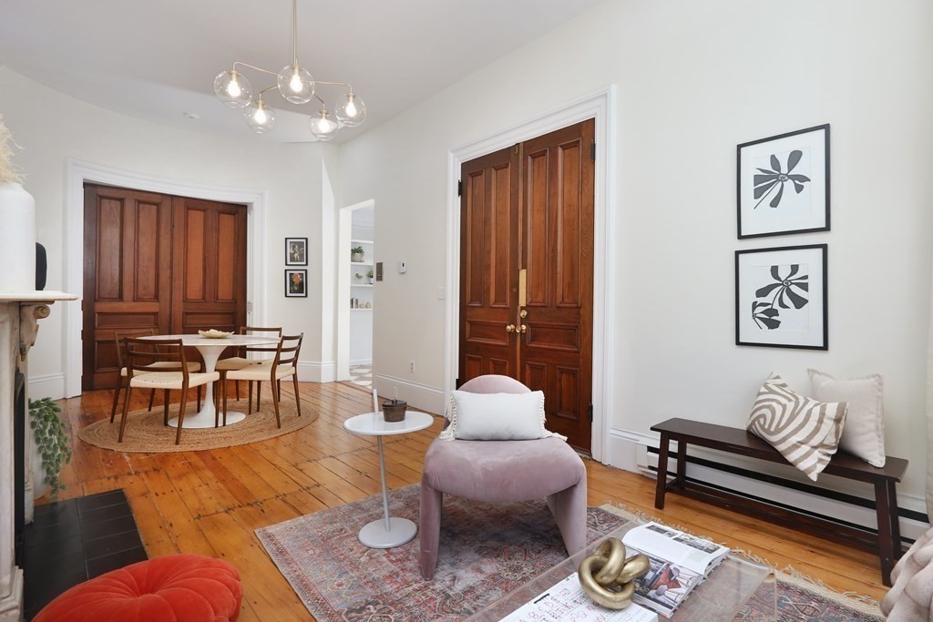 35 Milford Street, Unit 2 Boston, MA 02118 - Photo 2 of 12 a living room with furniture and wooden floor