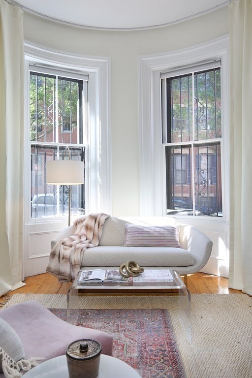35 Milford Street, Unit 2 Boston, MA 02118 - Photo 5 of 12 a living room with furniture and a large window