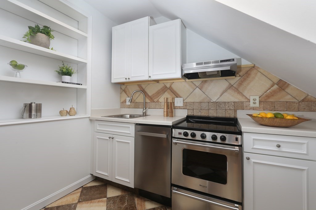 35 Milford Street, Unit 2 Boston, MA 02118 - Photo 6 of 12 a kitchen with a stove and a white cabinets