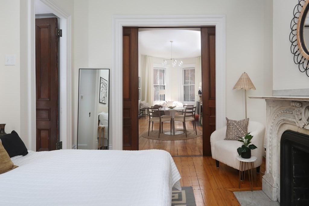 35 Milford Street, Unit 2 Boston, MA 02118 - Photo 8 of 12 a living room with furniture and a fireplace
