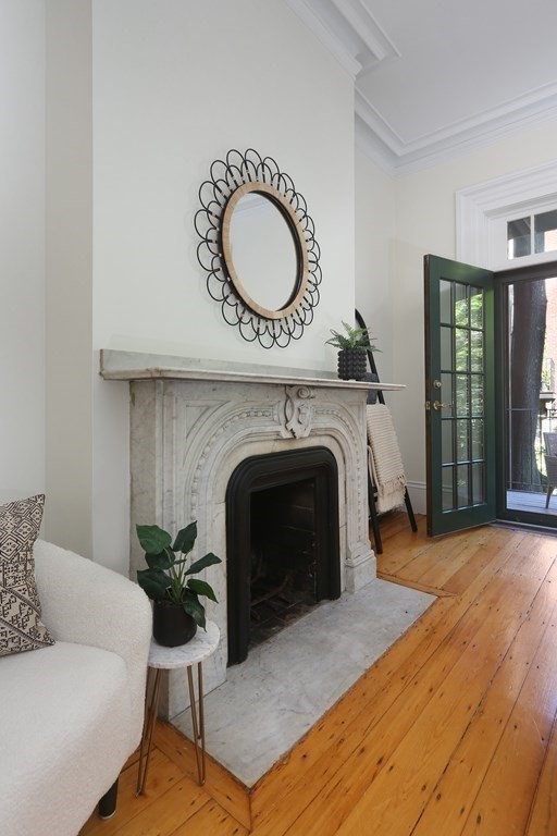 35 Milford Street, Unit 2 Boston, MA 02118 - Photo 9 of 12 a living room with furniture and a fireplace
