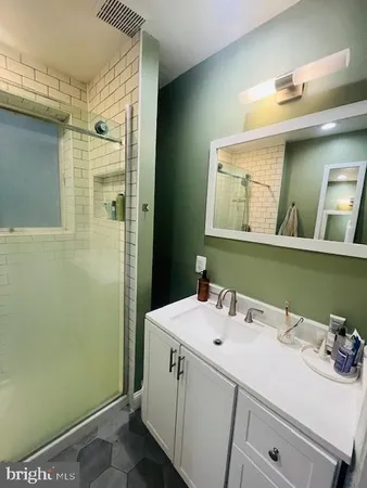 a bathroom with a toilet sink and shower