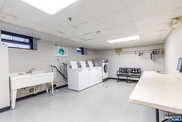 a room with furniture and white walls