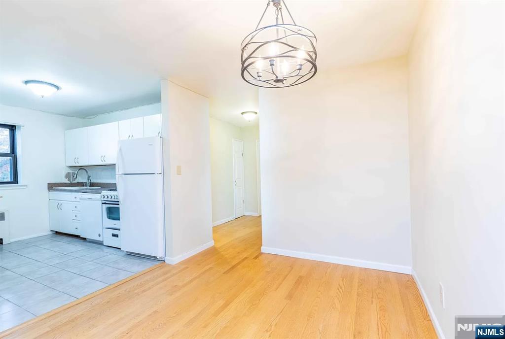 130 Orient Way, Unit 3D Rutherford, NJ 07070 - Photo 7 of 22 a bedroom with a bed and cabinets