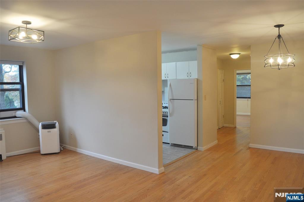 130 Orient Way, Unit 3D Rutherford, NJ 07070 - Photo 10 of 22 a view of a kitchen with a refrigerator a microwave and a sink