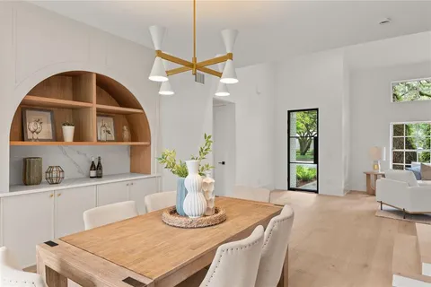 a kitchen with a refrigerator and a sink