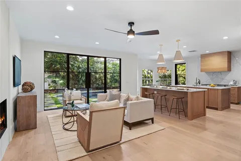 a bathroom with a double vanity sink a toilet and a mirror