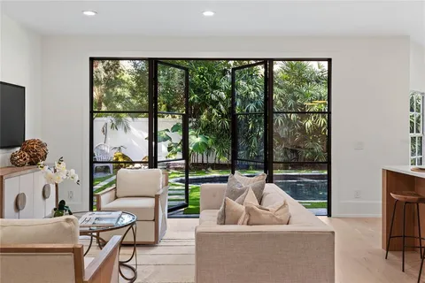 a bathroom with a granite countertop sink a shower and a mirror