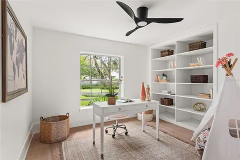 a bathroom with a sink vanity and mirror