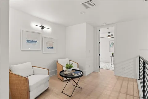 a view of a livingroom with furniture and a window