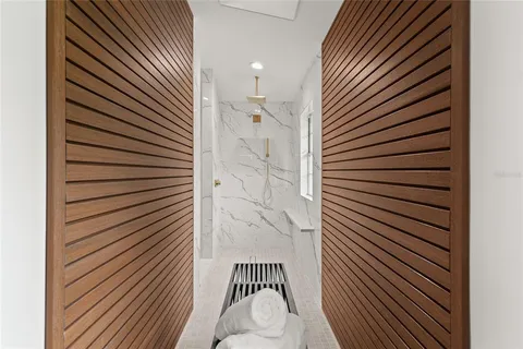 an aerial view of a houses with a yard