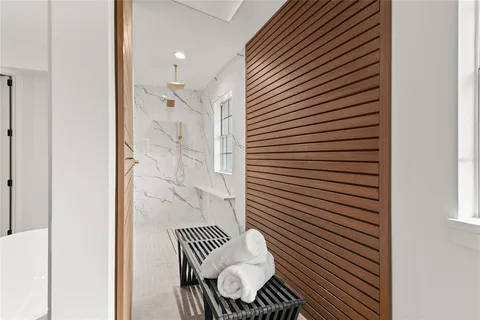 an aerial view of residential houses with city view