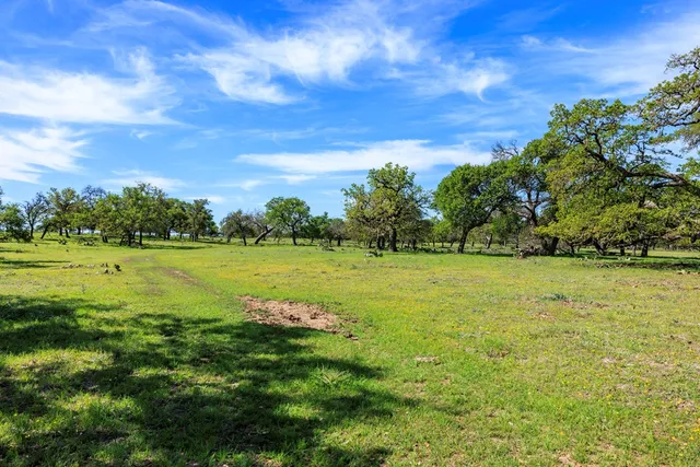 a view of a lake with a big yard