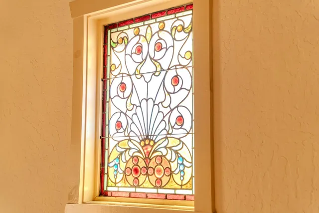 a view of a hallway with paintings on the wall