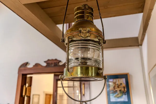 a hallway with wooden floor and entryway