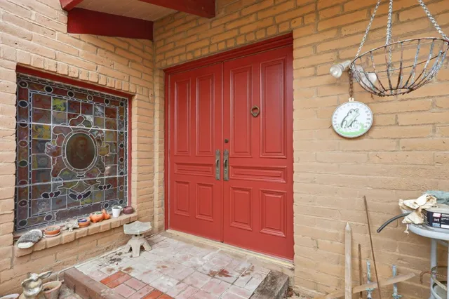 a kitchen with a table chairs stove and cabinets