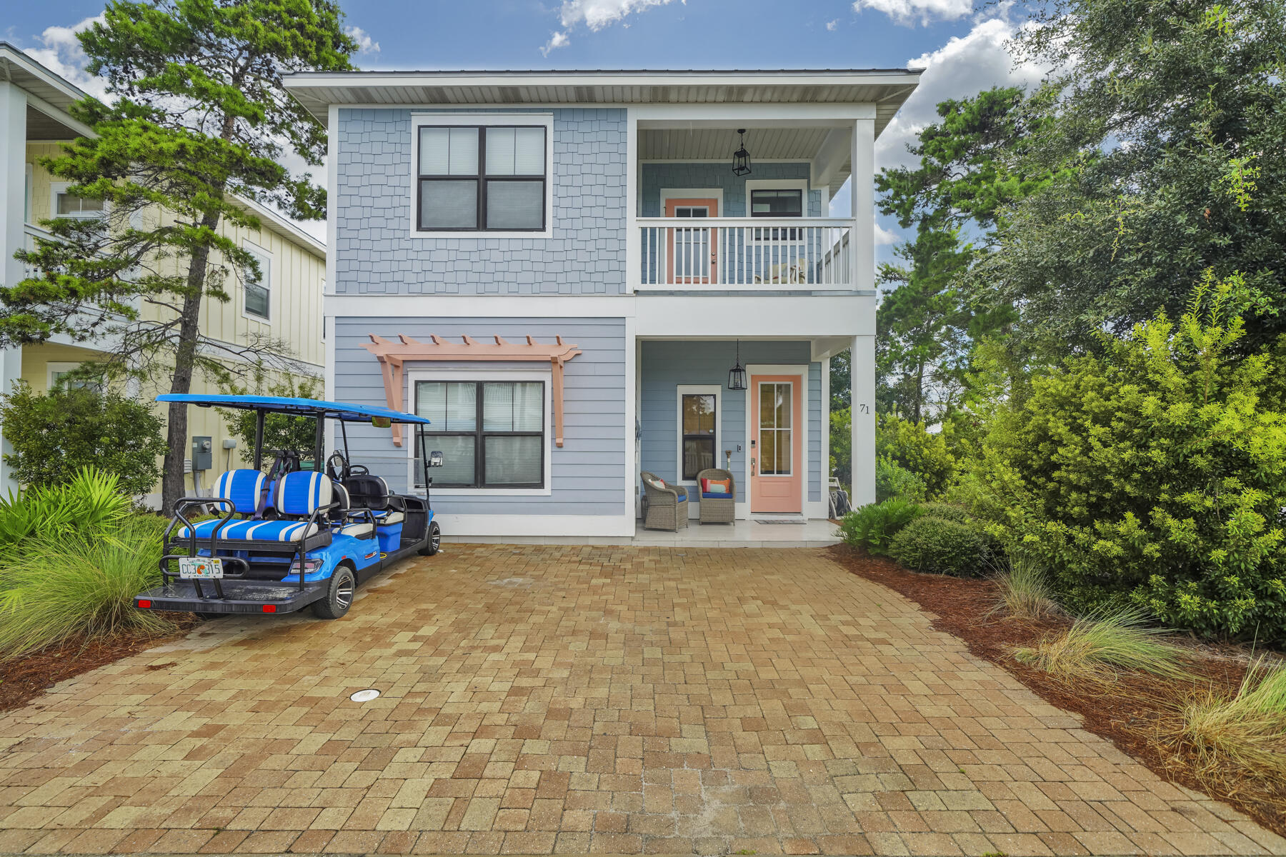 a view of a house with sitting area and garden