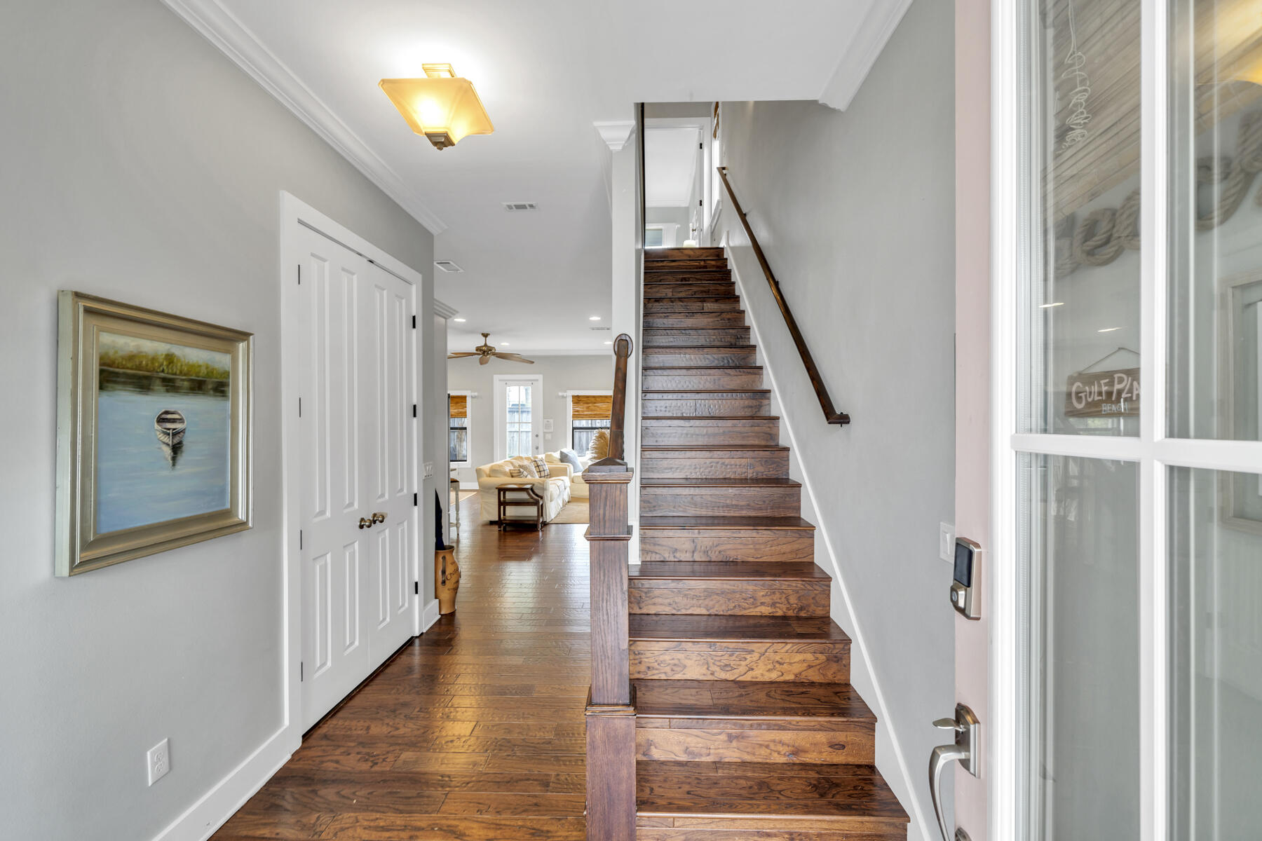 71 Emma Huggins Lane Santa Rosa Beach, FL 32459 - Photo 14 of 33 a view of a hallway with wooden floor and windows